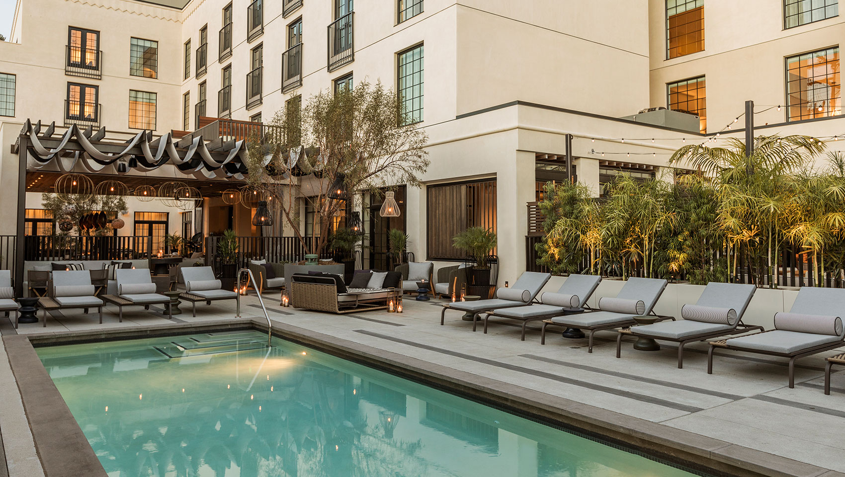 Pool and outdoor lounge at Kimpton La Peer Hotel