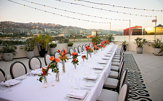 Event dining table set up on La Peer Rooftop Terrace