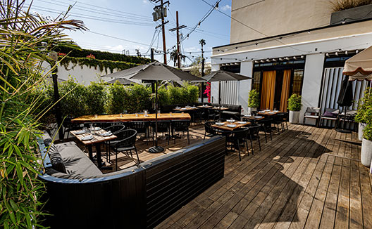 Ladyhawk Patio with seating at Kimpton la peer hotel