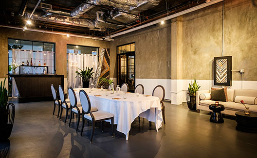 The Loft Event Space at Kimpton La Peer Hotel with meeting table set-up